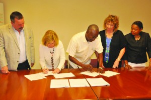 The signing Ceremony: L-R: Mr. Tim Grace, Ms. Cheryl Andrews, Mr. Leslie Richardson, Mrs. Jackie Pascher and Mrs. Candis Niles