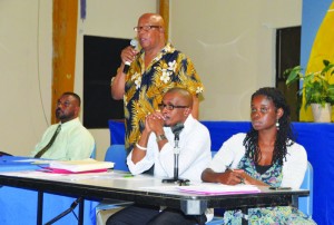 Chief Minister addressing consultation with Mr. Foster Rogers, Dr. Aidan Harrigan and Ms. Anthea Ipinson