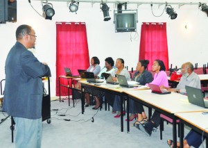 Dr. Hill lecturing educators