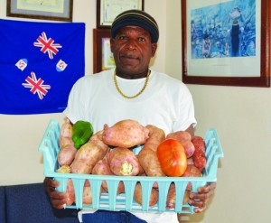 Lawson Harvey showcasing potatoes, tomatoes and peppers