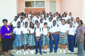 Deputy Principal Mrs. Melsadis Fleming (left) Honours Roll students and Head of Year Ms. Melsadis Fleming