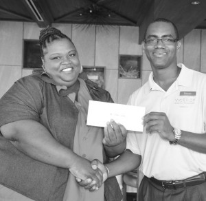 Mr. Viceroy's Peron Sepersaud presenting prize to Ms. Snagg