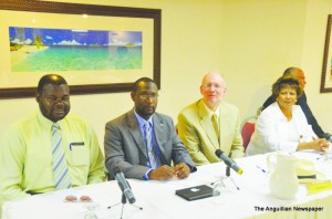 L-R: Hon. Evan Gumbs, Hon. Jerome Roberts, Governor Alistair Harrison and others