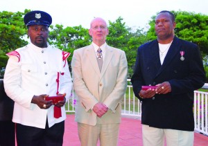 Long Service awards to Police Officers Mark Headley (left) and Detective Patterson (recieved by Inspector Emris Rogers)