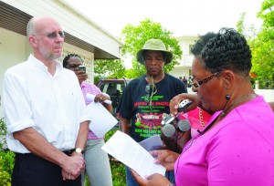 Ms. Jacqueline Richardson reading letter to Governor with Roosevelt Harris