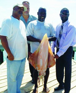 Sam Webster, Kenneth Hodge, Aristo R'dson and Hon. Jerome Roberts with Squid