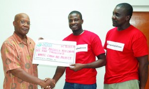 Mr. Carlson Lloyd presenting cheque to Mr. Grant Rodwell and  Mr. Ricki Rouphine of the Anguilla Red Cross