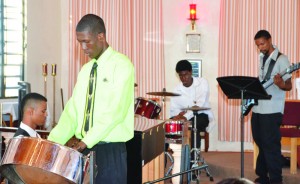 Musician Cordane Richardson on the Steel Pan with accompanying musicians