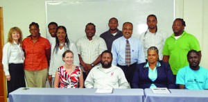 Seated from left: Sarah Barrington; Dallen Connor; Mavis John; Jerdigan Richardson;  Standing from left: Melinda Goddard; Patricia Wallace; Jermaine Payne; Almyrrh Richard; Juan Cornelio Gomez; Trevor Liburd; James Harrigan; Lorin Richardson; Rolston Hennis.