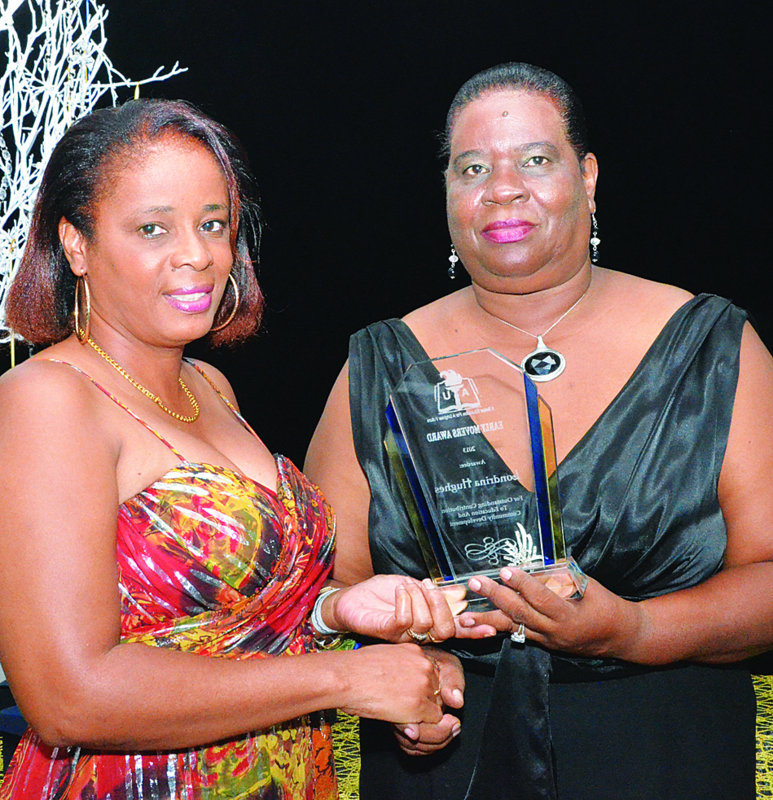 Ms Londrina Hughes receiving award