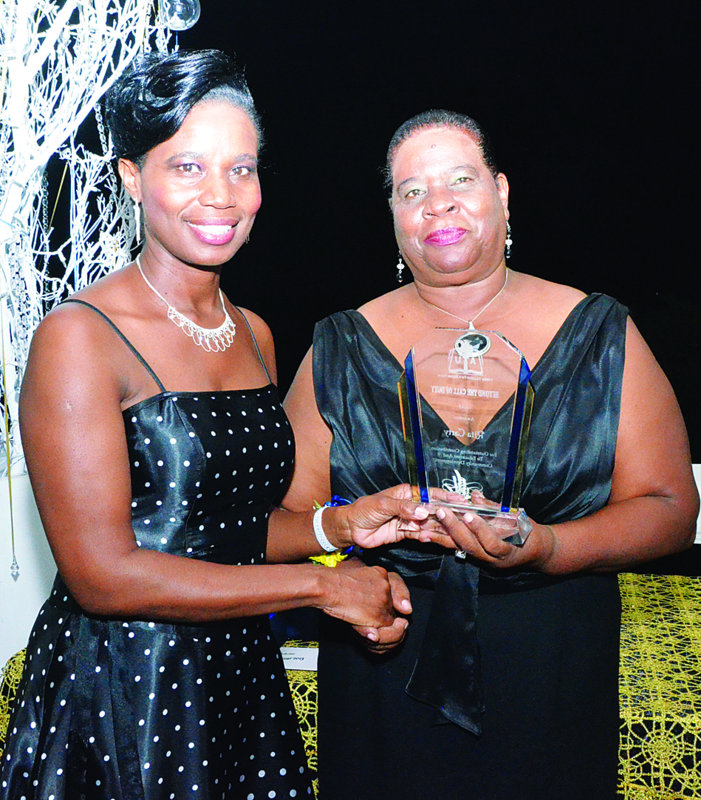 Mrs Rita Carty receiving award