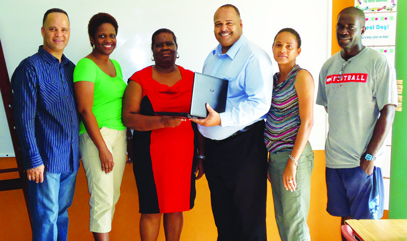 DR ELLIS LORENZO WEBSTER DONATES 10 LAPTOPS TO MORRIS VANTERPOOL SCHOOL