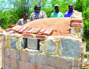 Oven under construction. Mr Linford Richardson (third from left)