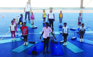 The Grade 1 Class playing a game on the sport court. 