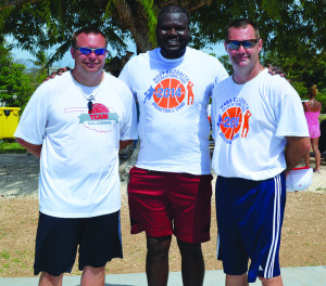 Mr Evan Gumbs flanked by visiting coaches