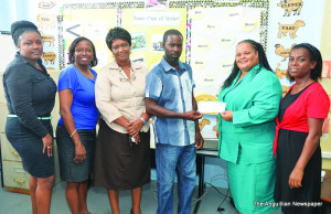 Mr. Owen Mussington presenting cheque to Mrs Katherine  Webster-Brown