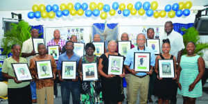 Family members of Seafaring Captains with mementos. Minister Evan Gumbs (Back row, far right)