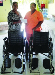 Myrtle Smith of the Governor’s Office, making presentation of the Wheelchairs to Nurse Corrine Hodge