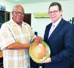 CM Hughes and Dr. Smith (Photo Source: CDB's website)