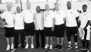 Coaches l to r: Dave Barrett, Louis Price, Don Byron, Joe Farroba, Brian Ferris, Delano Mussington, Omari Hamilton (Ian Connor and Simba Price missing) with Hon. Jerome Roberts, Minister of Sports (4th from left) .