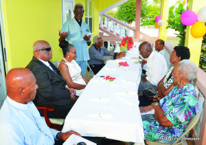 Rev. Roberts speaking at Anniversary service and party