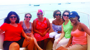 Journalists enjoy a tour around the island on a glass bottom boat. From left:  Nancy Schretter, Jennifer Friebely Earle, Waheeda Harris, Peta Phipps, Judy Koutsky and CAMC Representative Jennifer Johnson