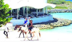 Press guests try horseback riding at Cap Juluca on the white-sand beaches of Maundays Bay Pictured:  Judy Koutsky and Peta Phipps.