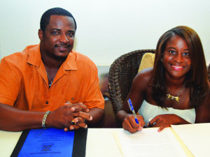 Mr. Mitch Lake and Tamisha Richardson  signing agreement