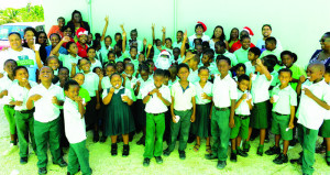 Happy Students of the Vivian Vanterpool Primary School, Teachers, Digicel Elves and Santa and Tropical Treats Team