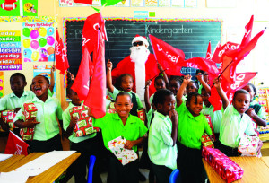 Kindergarten and Grade 1 recieving presents from Digicel Santa