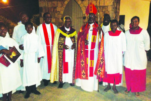 Rev. Knight and Bishop Brooks (centre) with Servers. Photo submitted.