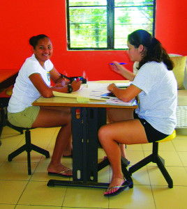 Jasmine and Isobel creating a poster