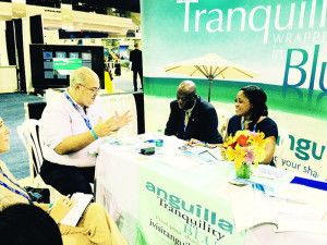 From left, ATB Chairman Ralph Hodge and ATB Deputy Director Chantelle M. Richardson met with buyers during Caribbean Marketplace 2015.