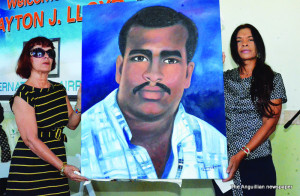 Mrs. Lena Lloyd and Lisa Lloyd with portrait of Captain Clayton Lloyd 