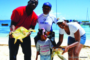 Kafi Gumbs (centre) with volunteers