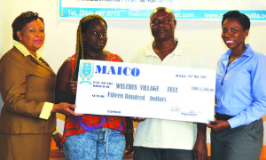 Joan Hodge, Assistant Manager and Anthea Connor, Compliance Officer presenting Cheque to Joseph Vanterpool and Malicia Bradshaw for the Welches Village Fest Committee