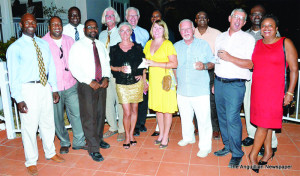 Hon. Cardigan Connor and Mr. Foster Rogers (1st & 3rd from left) with various business personel