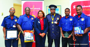 Fire  officers with Scotia Bank's General Manager