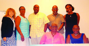 ATB Board of Directors: (seated) Myrna Sasso; Gilda Gumbs-Samuel: (standing) Melinda Goddard; Chairperson, Donna A. Banks; Chesney Hughes; Fred Thompson; Kelita Lloyd