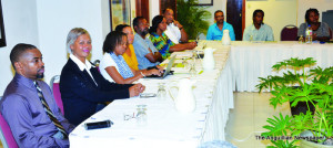 Acting Governor Stanley Reid and Pam Webster(left) with workshop participants