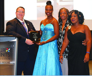 Members of Anguilla delegation receive Advisor of Excellence Award on behalf of  Opt. Emma Ferguson