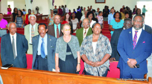 Pastor Berg (far right) and congregation members