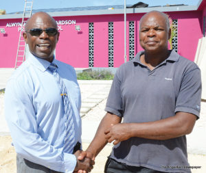 Mr. Cardigan Connor (left) welcomes  Mr. Jonathan Gumbs 