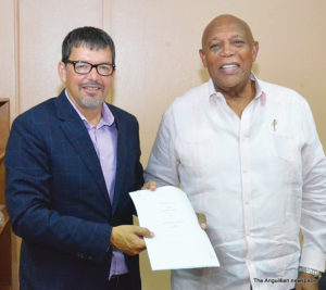 CCC Principal Mr. Luc Allary and CM Banks displaying signed MOU document