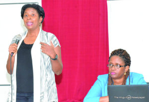 Minister Cora Richardson Hodge along with PS Chanelle Petty Barrett adressing meeting