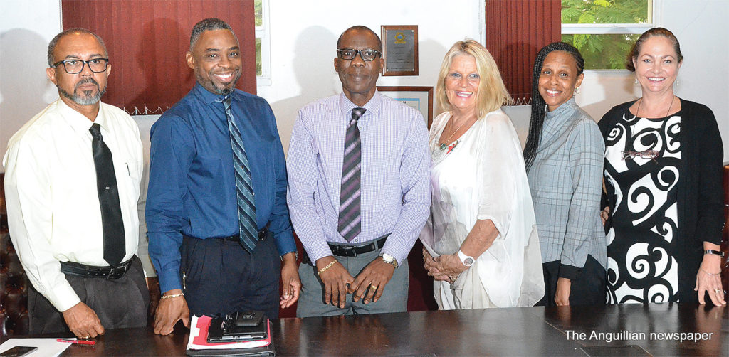 L- R: Minister Evans McNiel Rogers, Mr. Stanley Reid, Dr. Brett Hodge,  Mrs. Jacqueline Ruan, Mrs. Maeza Demis-Adams and Mrs. Fiona Curtis